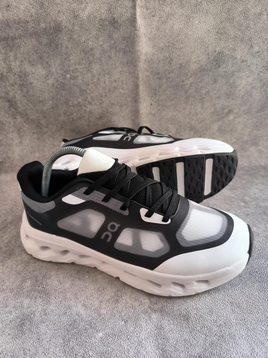 On On Cloudtilt Remix sneakers in a black and white colorway